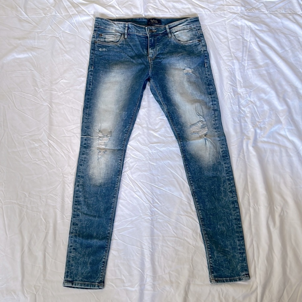 Faded blue ripped jeans